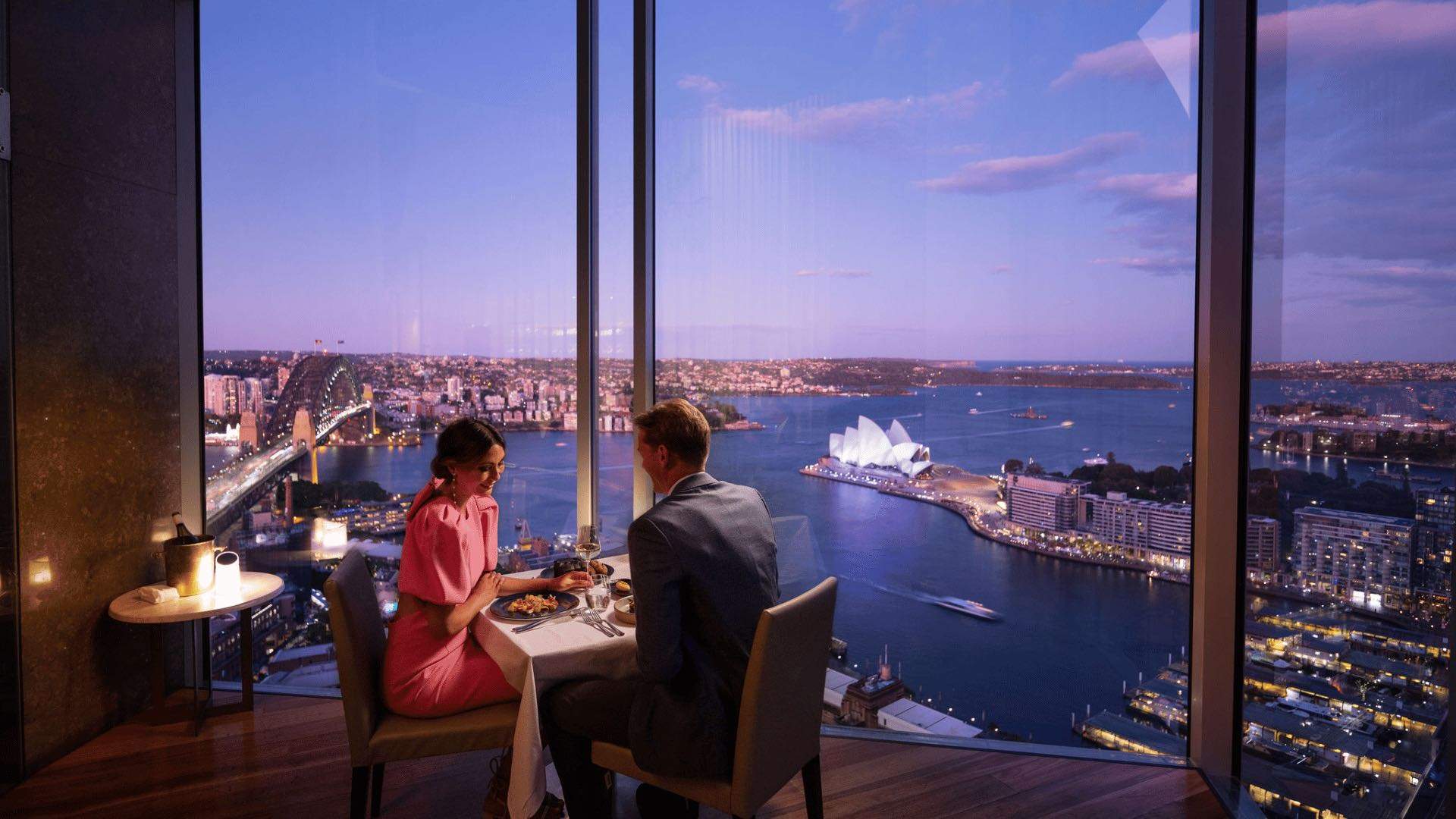 A couple having a meal overlooking Sydney Harbour at the Shangri-La Sydney hotel.