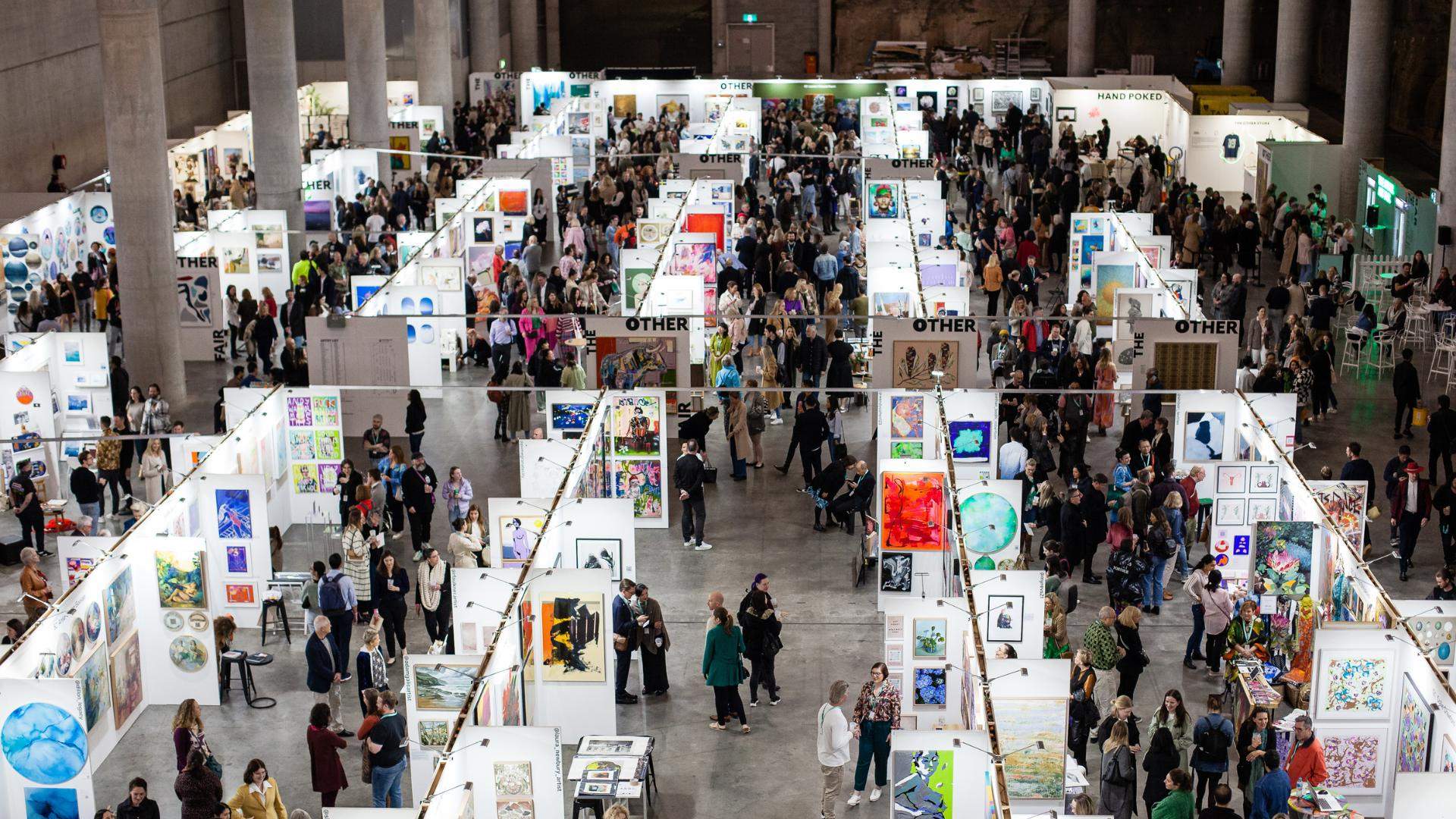 A birds eye view of rows and rows of art installations and artist stalls at The Other Art Fair at a huge underground space in Barangaroo.