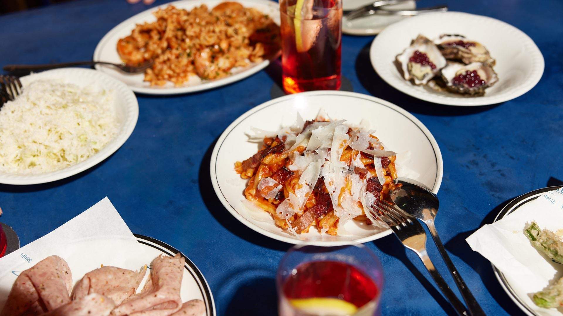 Various dishes from the Four Pillars x Fabbrica dinner on a dining table.