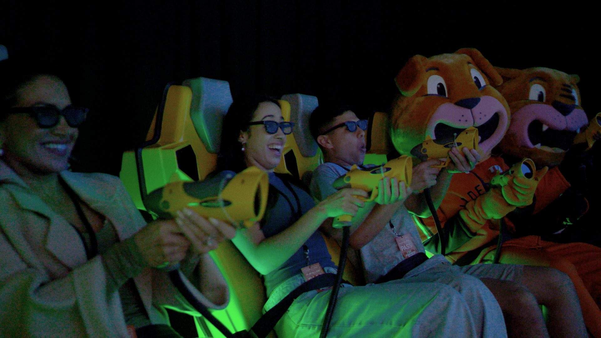 A group playing an arcade game at The Funderdome.