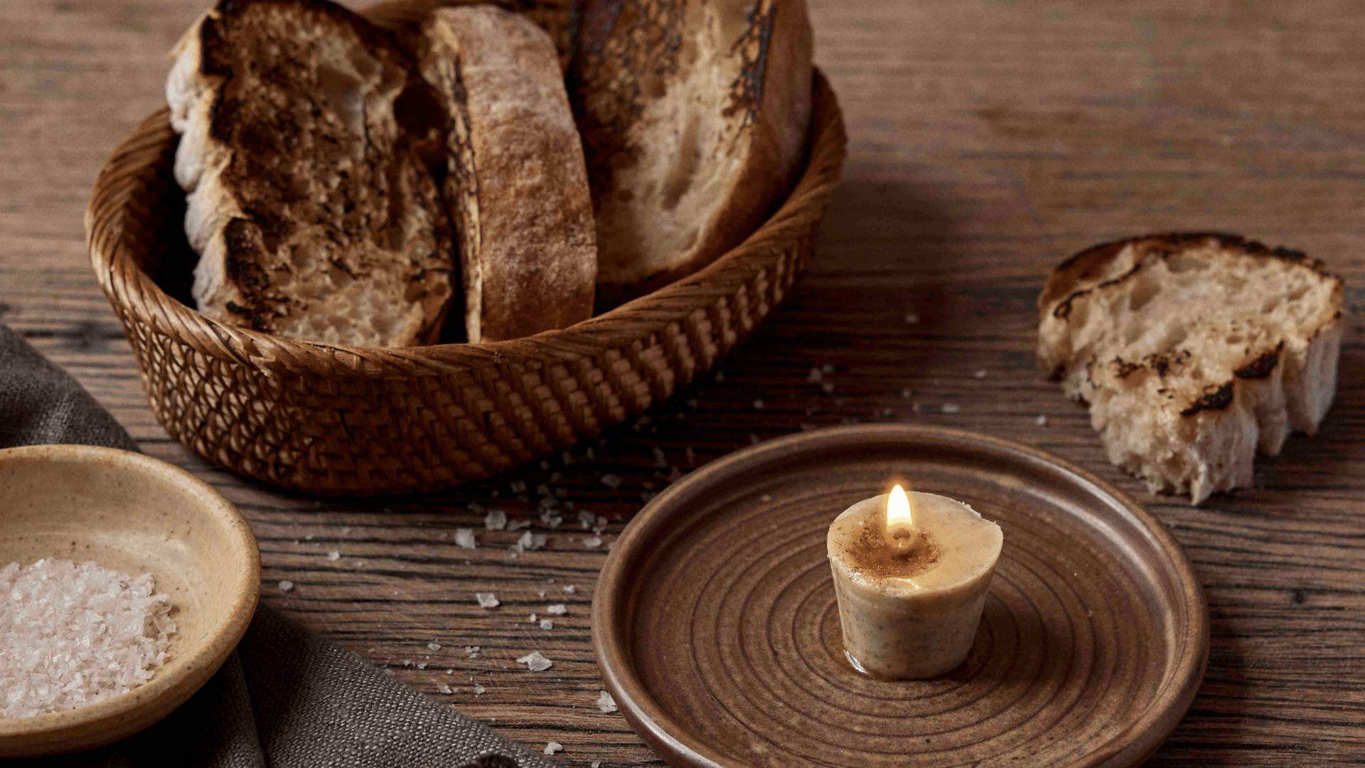 Photo of bread with a butter candle at Iberica.