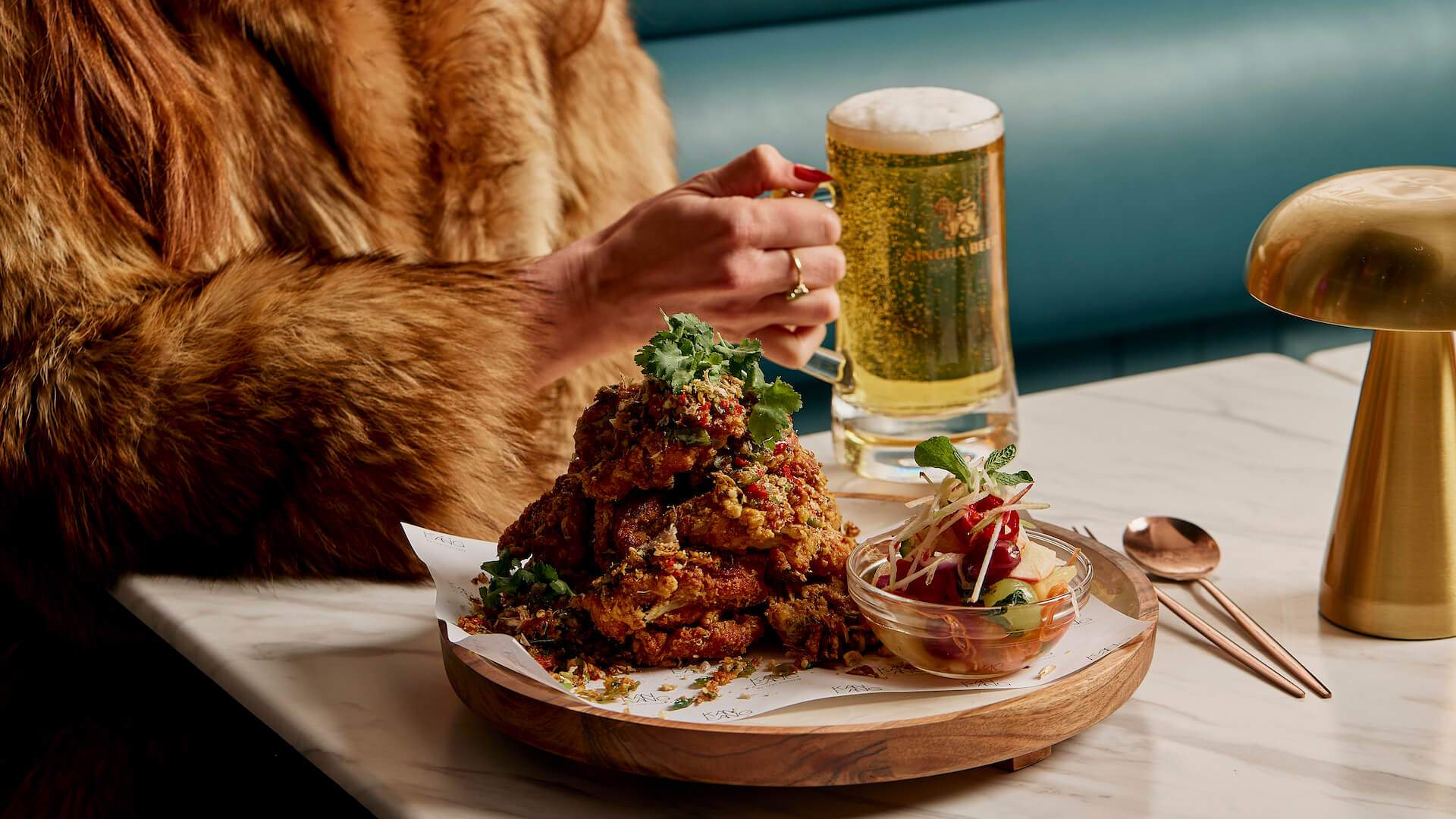 Fried chicken ribs and beer at Kan Eanf - Thai restaurant in Melbourne