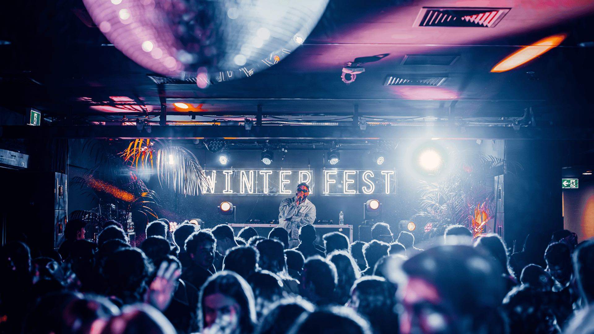 A musician performing in front of a crowd during Winterfest at The Underground UTS.