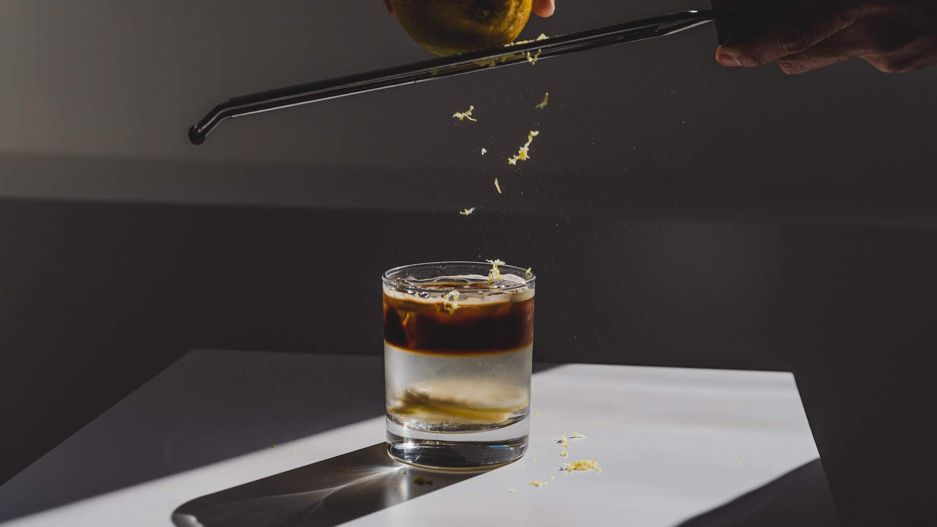 The iced citrus long black made with a shot of coffee, a few slices of lemon and a dusting of lemon rind from INI Studio - home to some of the best coffee in Melbourne.
