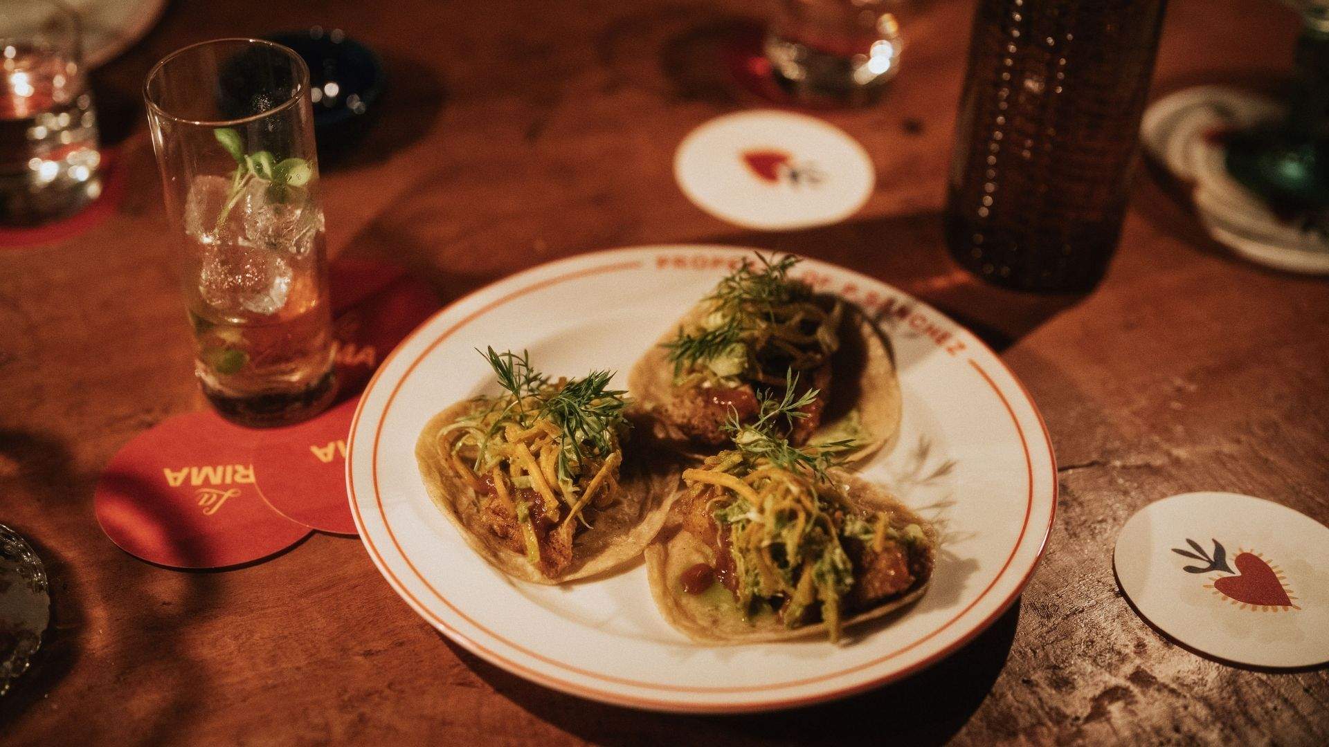 Bites (tacos) from the El Primo Sanchez menu alongside exclusive cocktails available at its hidden speakeasy, La Prima.