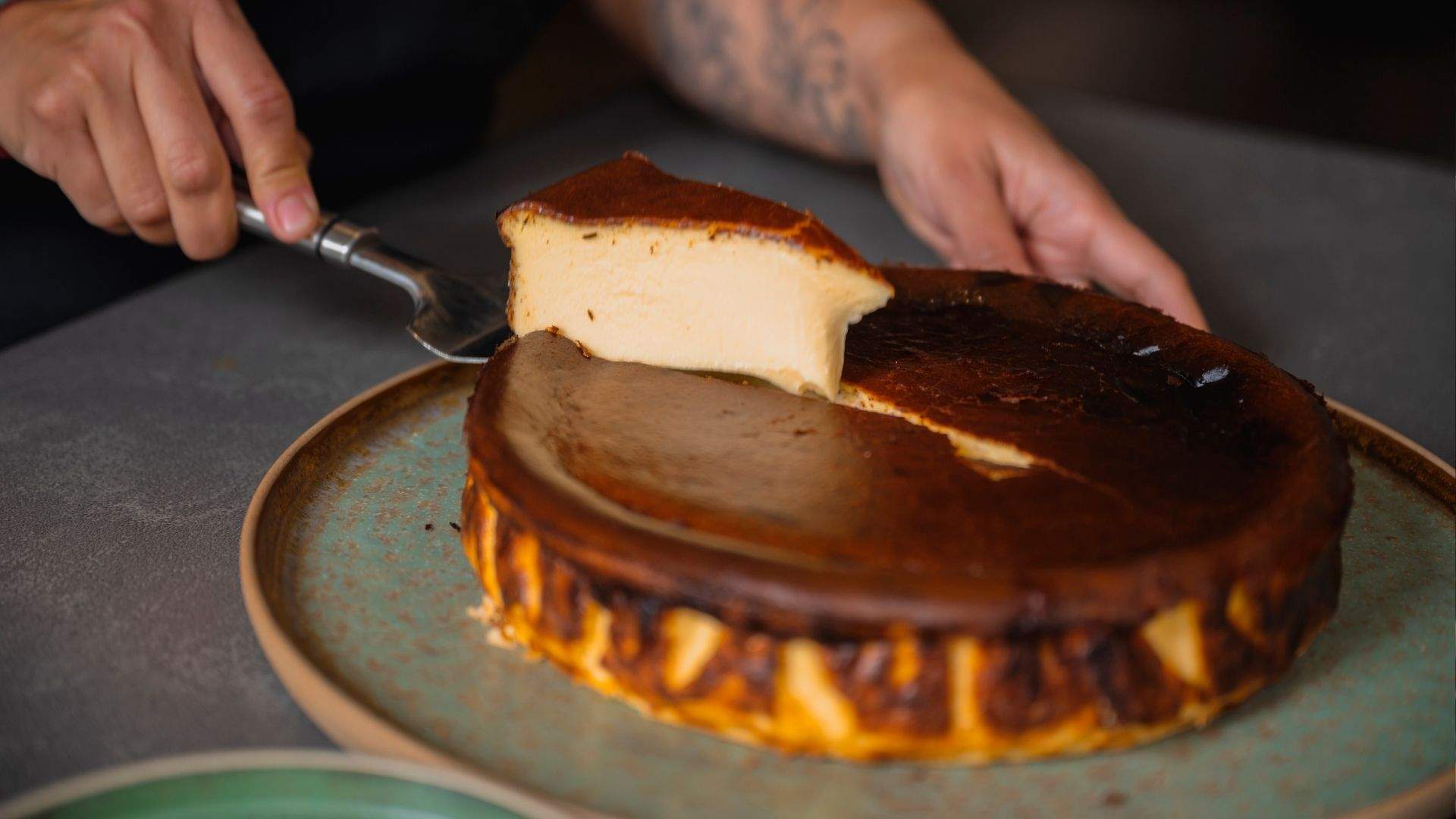 A slice of burnt cheesecake for smooth, velvety goodness with balanced sweetness and a touch of smoke from Two Good Cafe Co's october menu by chef Mat Lindsay.