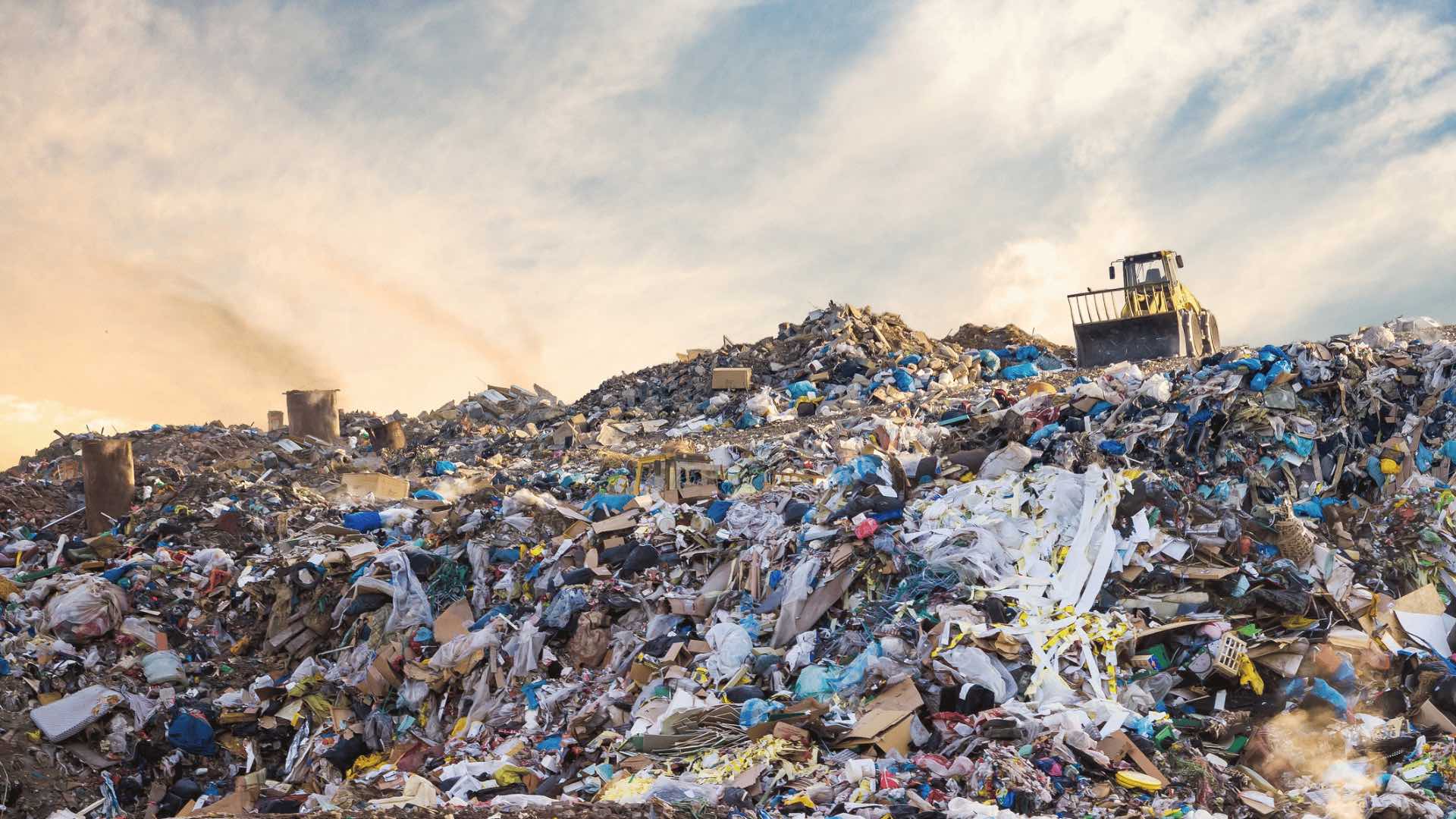 Photo of a huge pile of rubbish in landfill.