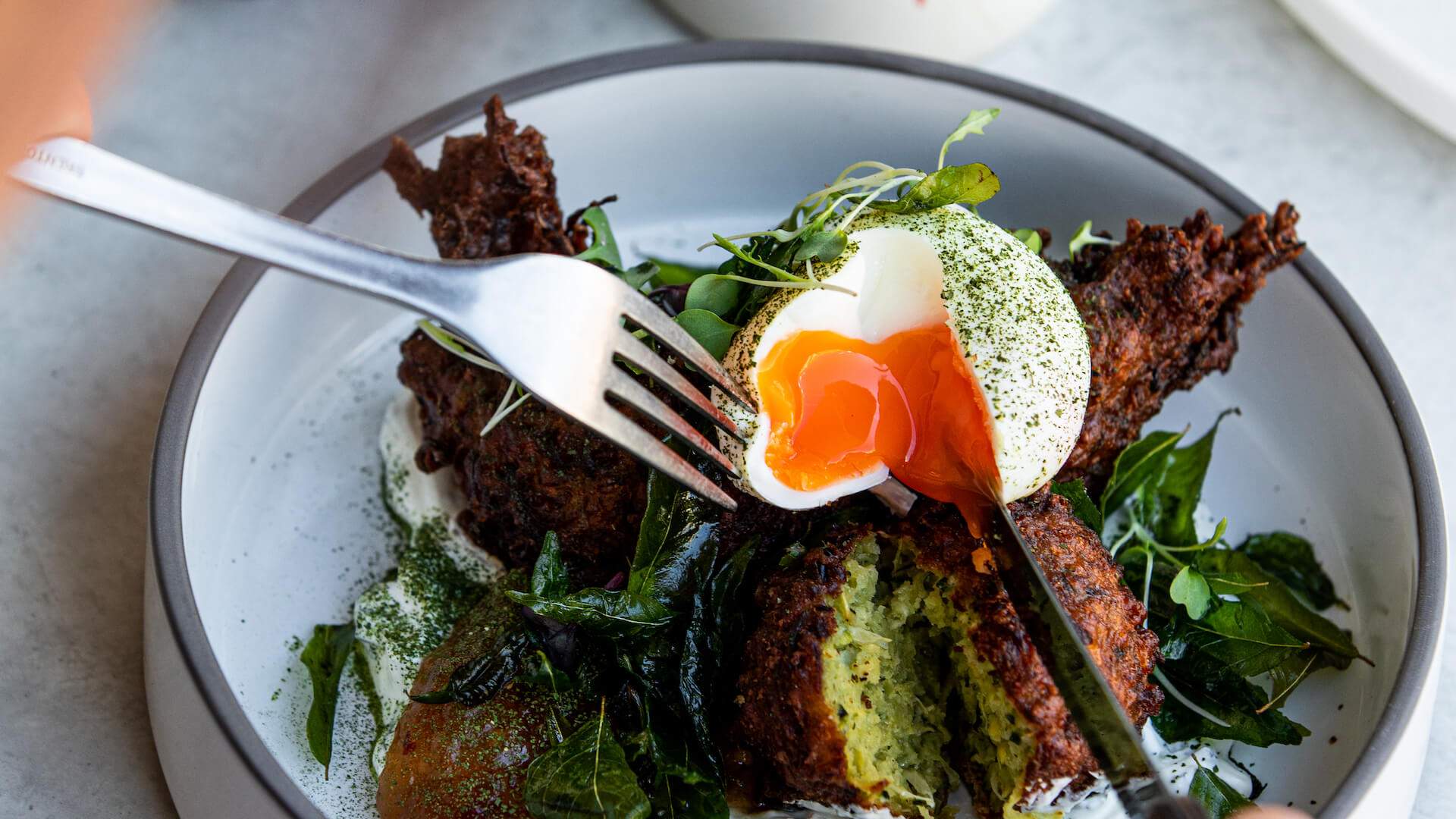 Zucchini fritters at TInker cafe in Northcote.