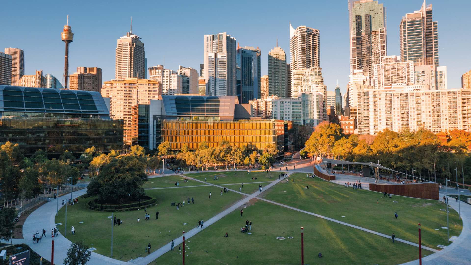 Photo of Tumbalong Park with the city skyline behind it.