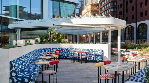 A breezy rooftop bar with colourful furniture