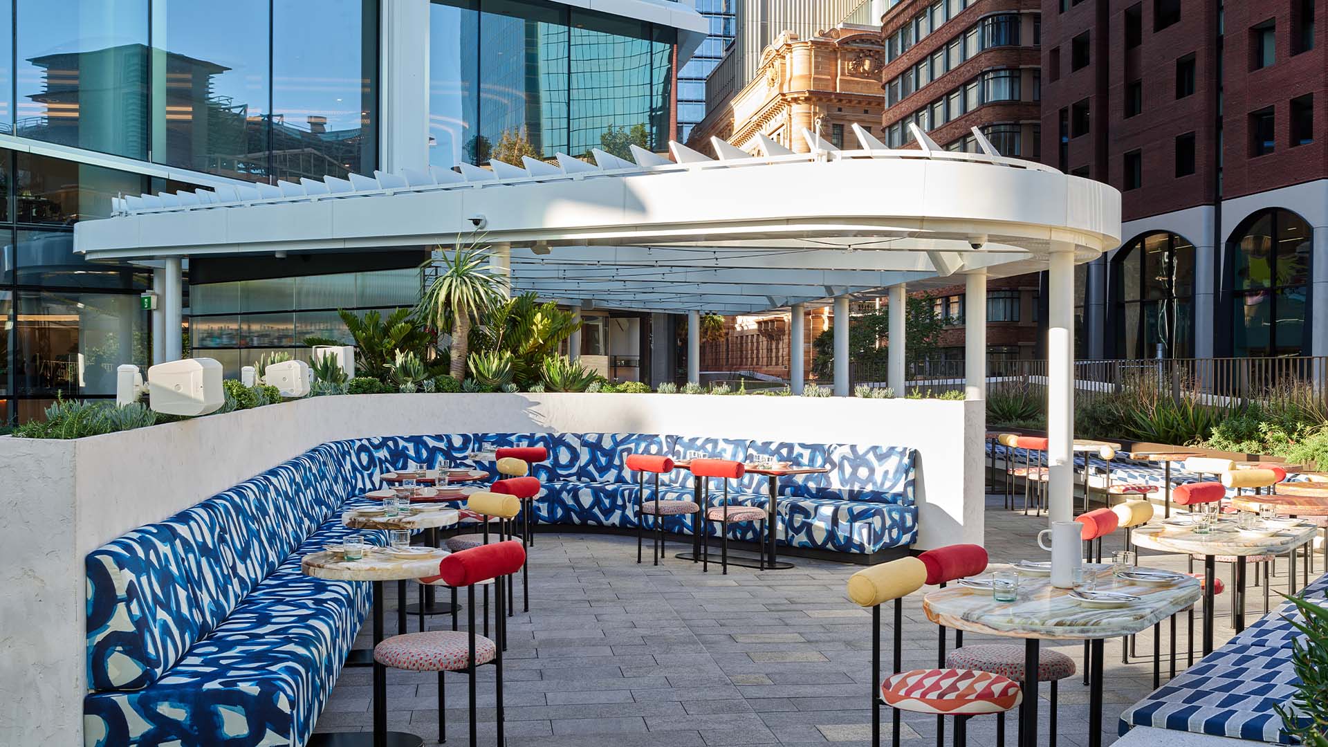 A breezy rooftop bar with colourful furniture