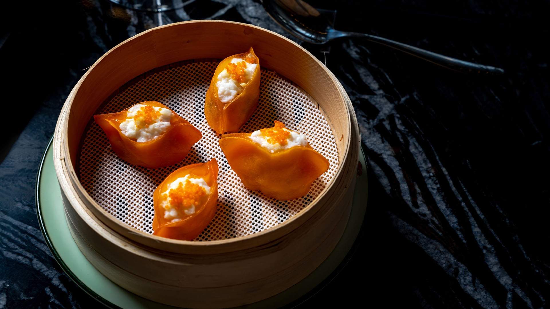 Prawn dumplings topped with egg cloud and roe at Pearl in Circular Quay