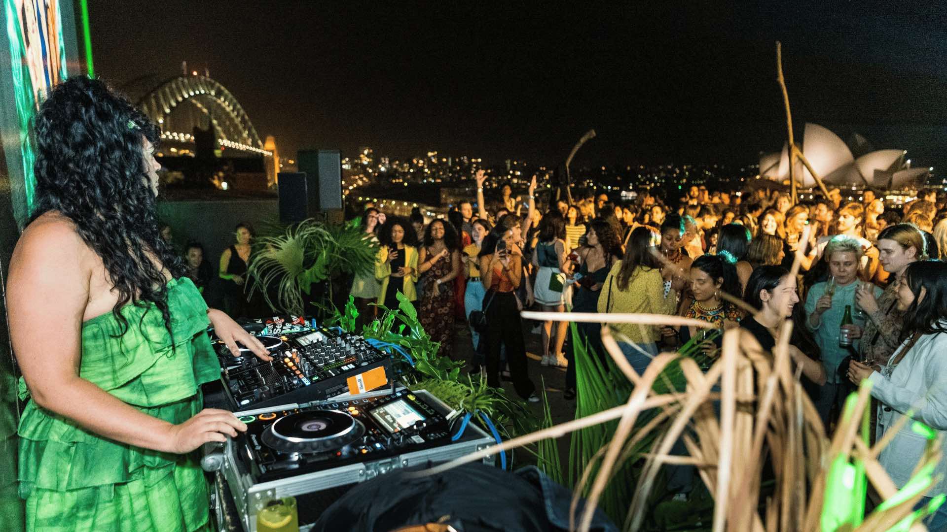 A DJ and crowds on the MCA rooftop.