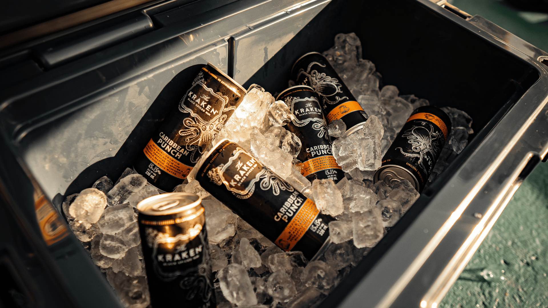 Cans of Kraken Caribbean Punch on ice.