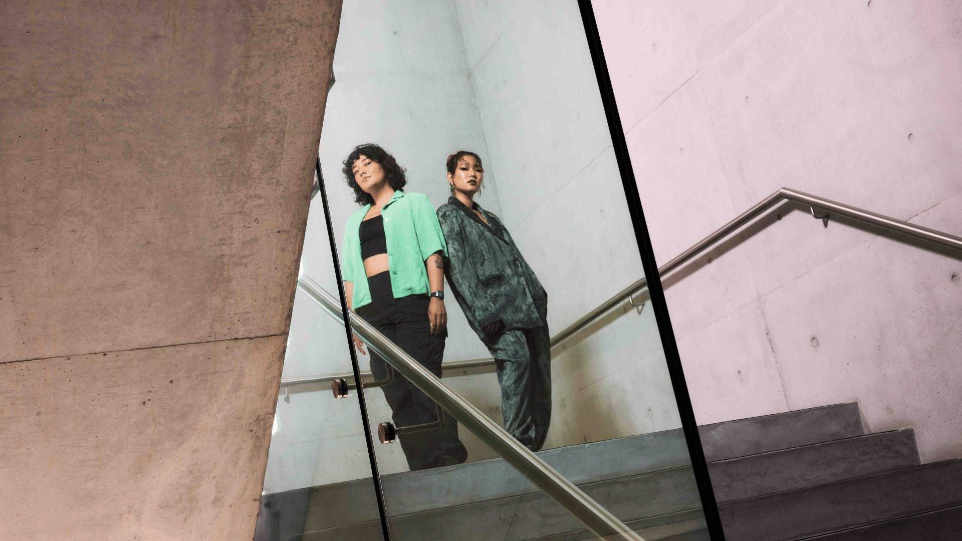 Two artists on the stairs of the Museum of Contemporary Art.