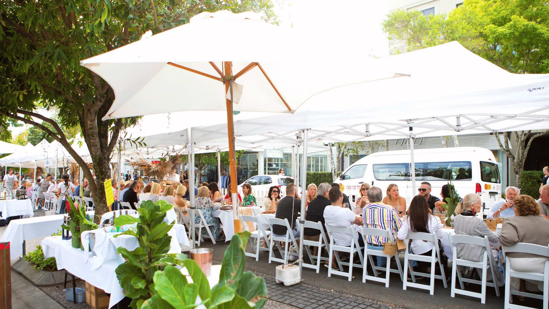 Long lunch tables set up as part of Noosa Eat and Drink Festival.