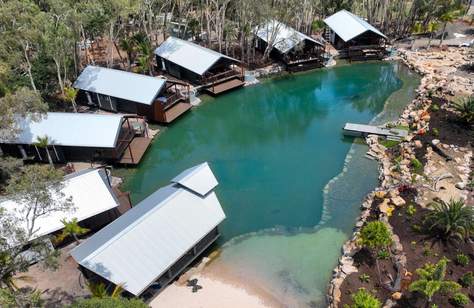 Sandstone Point Holiday Resort Is Adding Overwater Villas with Private Plunge Pools Just in Time for Summer Stays