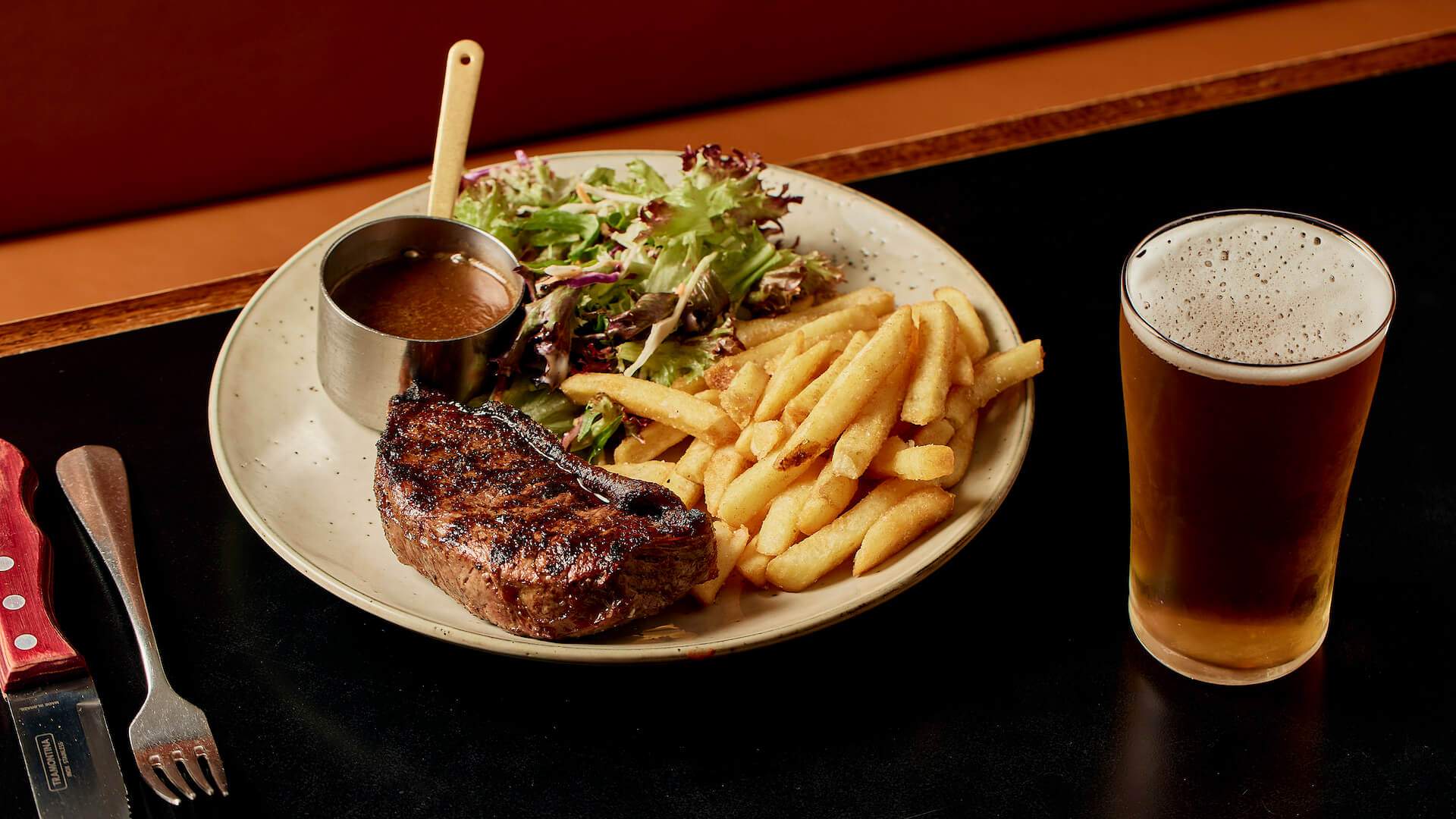 Steak and chips at Skinny Dog Hotel's rooftop.