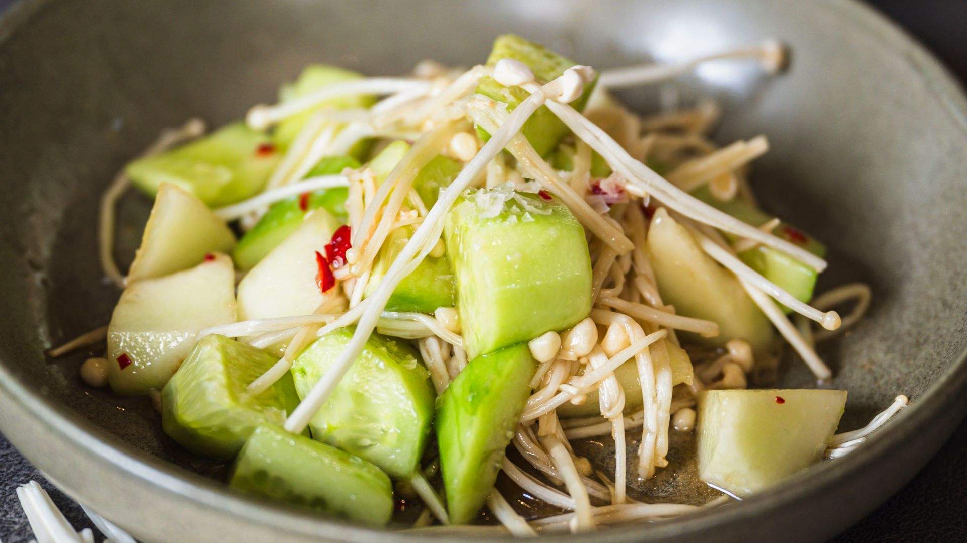 Cucumber, piel de sapo & enoki salad with hot & sour dressing & rice noodles from Mitch Orr's monthly menu takeover for November 2023 at Two Good Co Cafe.