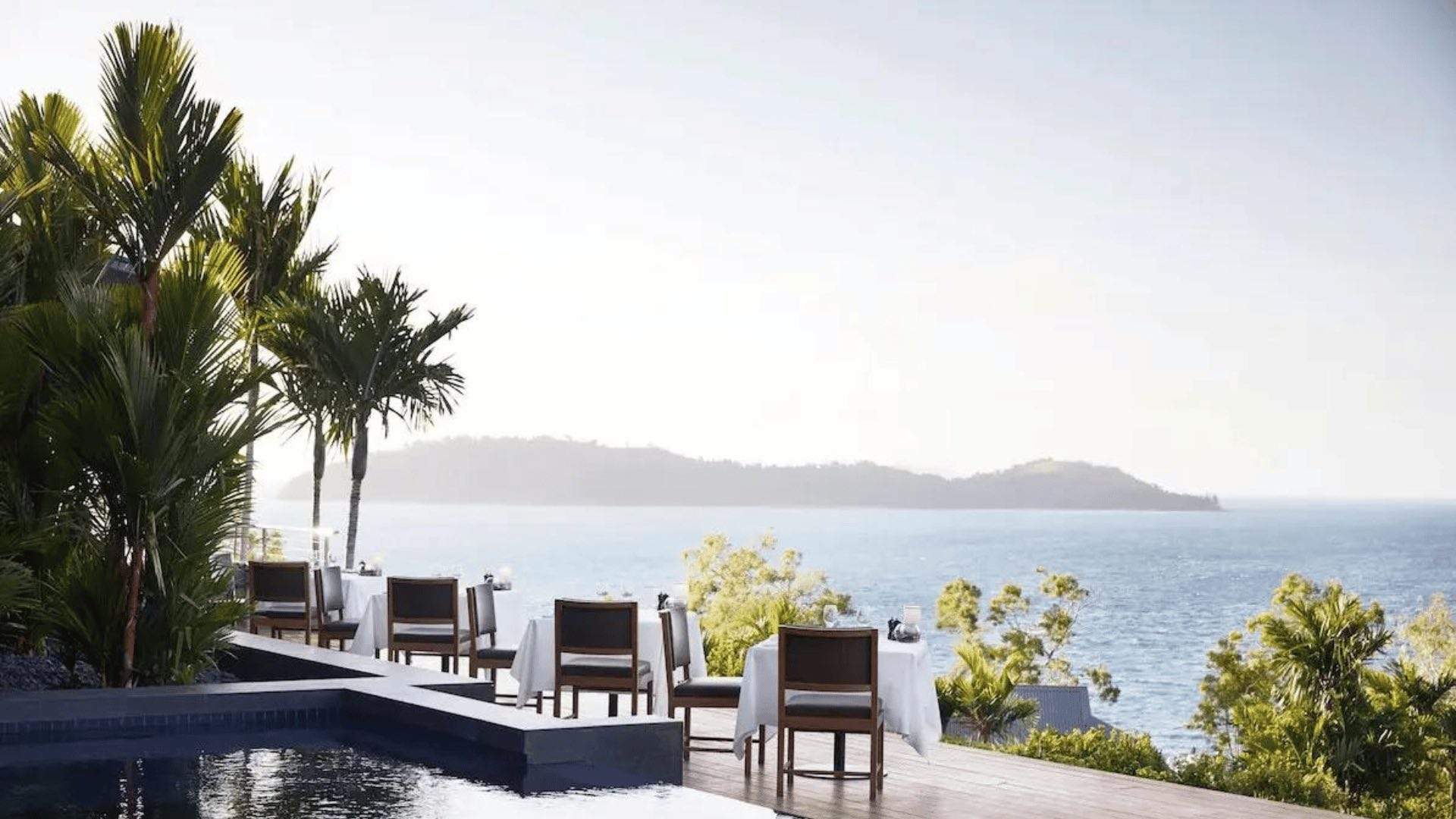 Dining tables overlooking the ocean at qualia resort on Hamilton Island.