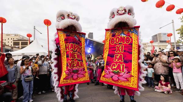Two lion dancers during Lunar New Year in Parramatta.