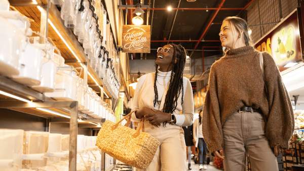 Two women shopping at the Adelaide Central Market.