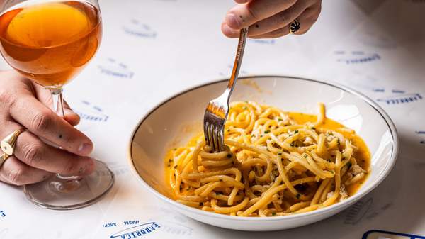 Cacio e pepe and orange wine from Fabbrica Pasta Bar. 