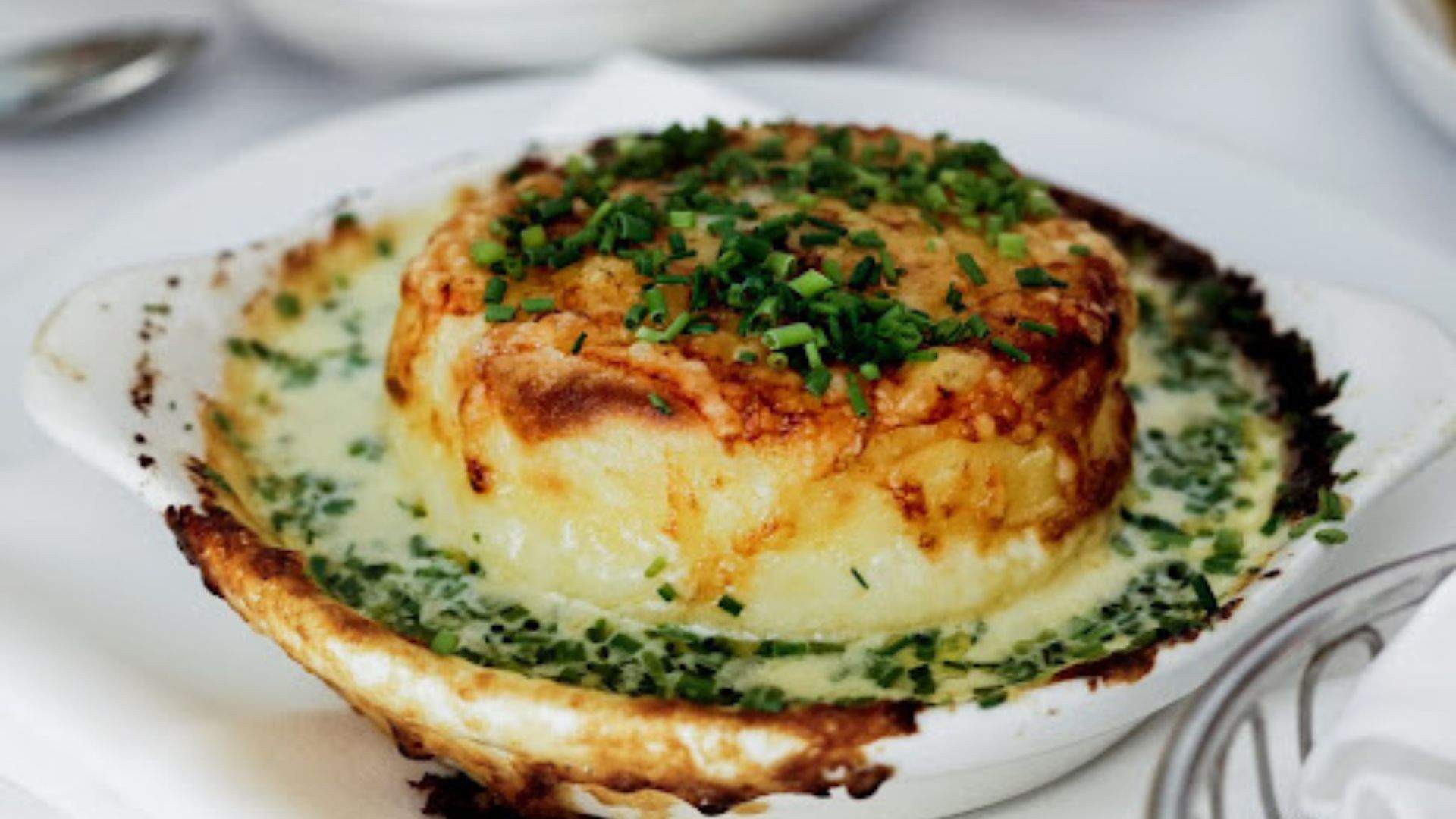 Macleay St Bistro new location with it's OG food: twice-baked French onion cheese souffle.
