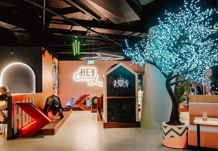 Background image for Now Open: Hey Caddy and X-Golf's South Bank Venue Boasts a 12-Hole Indoor Mini-Golf Course, Golf Simulator and Bar