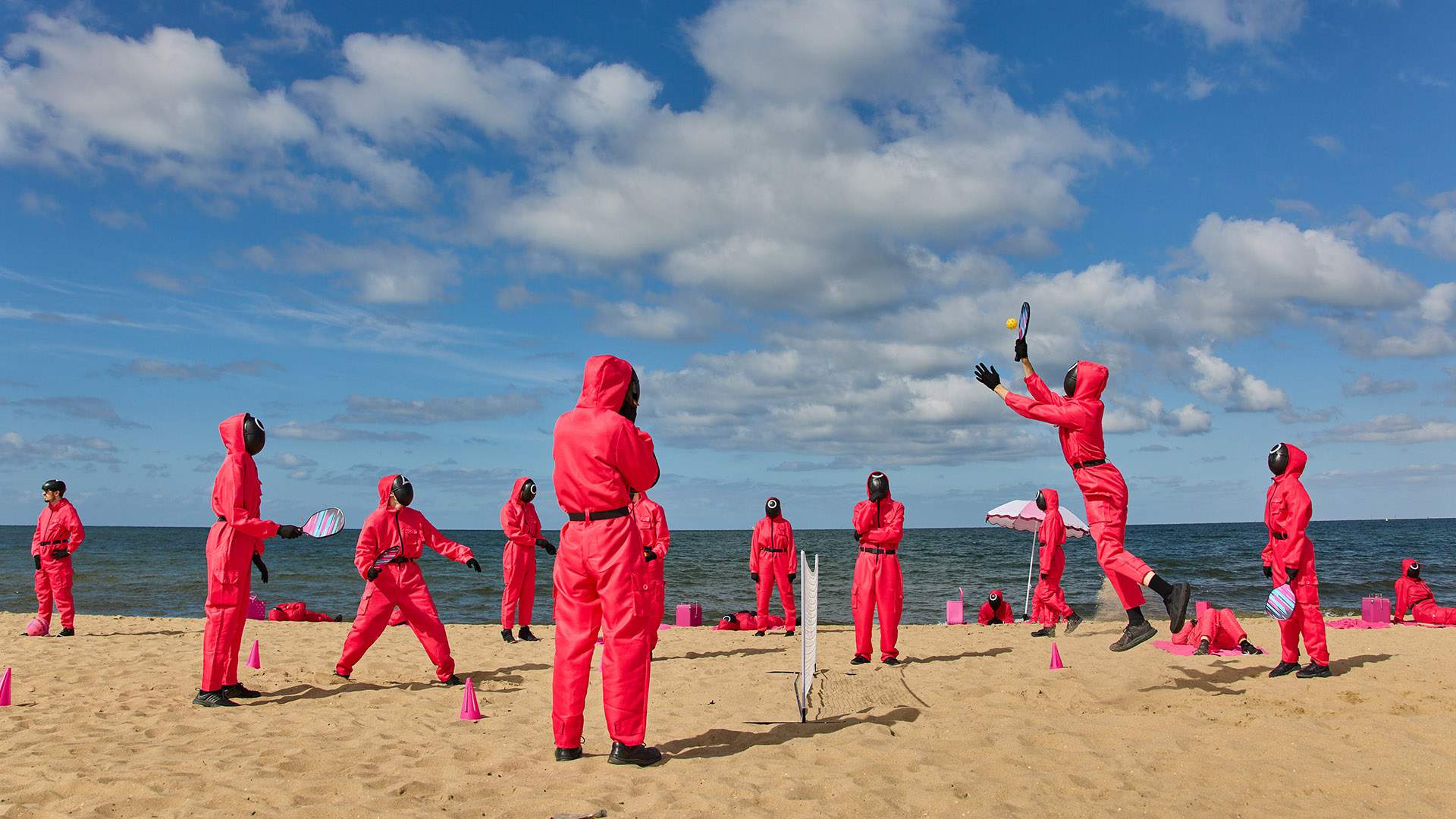 'Squid Game' in St Kilda: Here's What Happened When 200 Pink Guards Took Over an Australian Beach