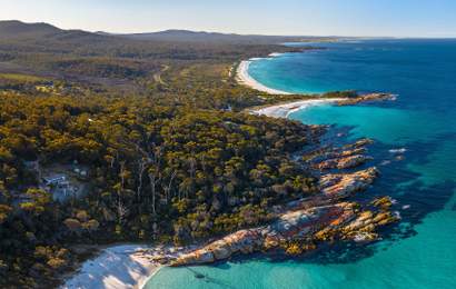 Background image for Bay of Fires' Ten-Kilometre Stretch of Beaches in Tasmania Has Been Named Australia's Best for 2025