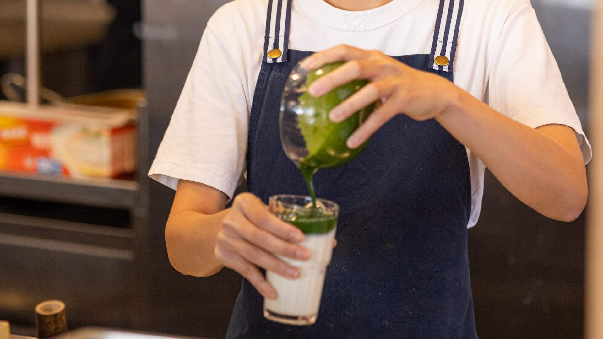 Barista pouring a matcha