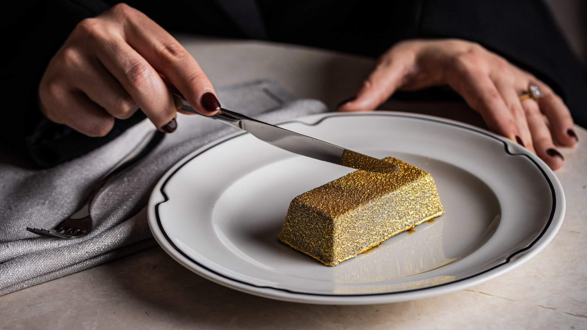 Luke Mangan Has Unveiled a Golden Chocolate Bar Dessert Hiding Prizes Worth Up to $50,000