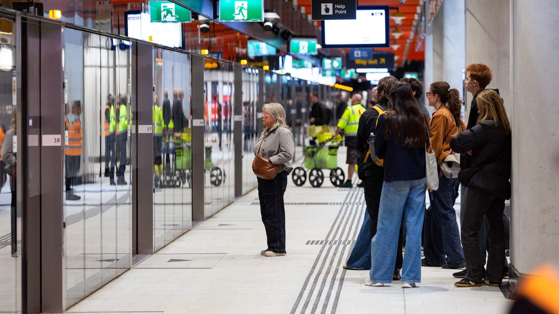 MELBOURNE, AUSTRALIA - DECEMBER 01: Passenger wait on the platform at Arden Station on December 01, 2025 in Melbourne, Australia. The Melbourne Metro Tunnel consists of nine kilometres of rail beneath Melbourne's CBD, and five new stations, intended to significantly improve Melbourne's traffic and commuter flow. (Photo by Jesse Thompson/Getty Images)