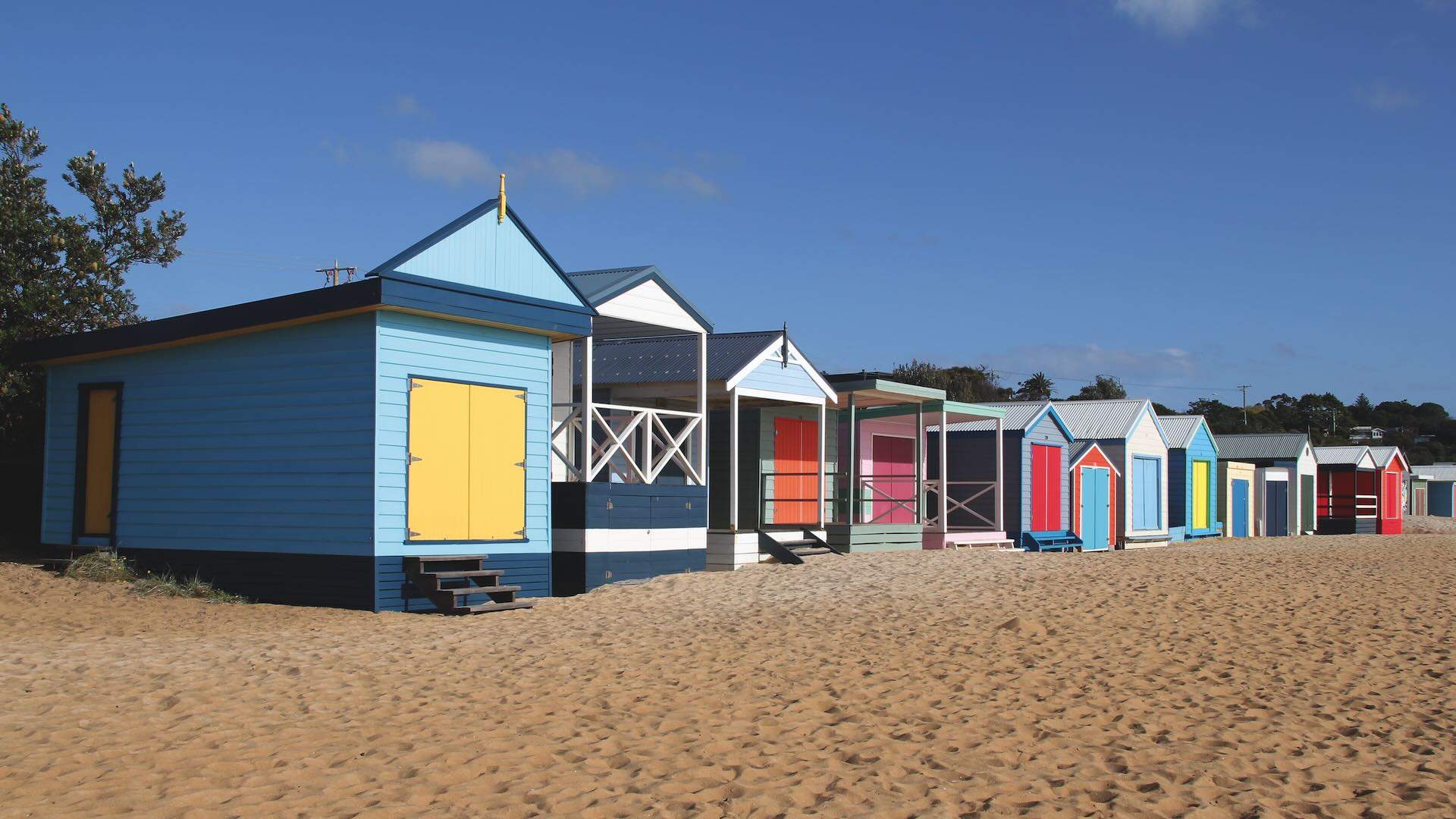 Colorful beachhouses on the beach at Mount Martha in Victoria, Australia on a sunny day; Shutterstock ID 2294952553; purchase_order: -; job: -; client: -; other: -