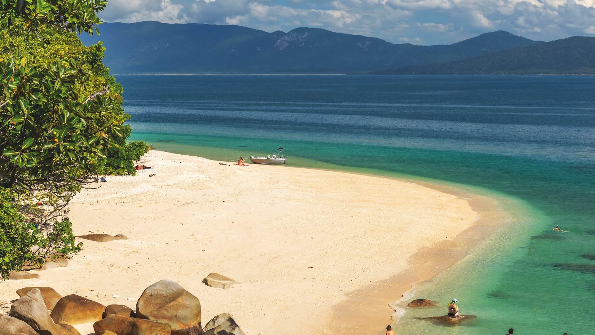 Picturesque tropical golden Nudey Beach with turquoise water on Fitzroy Island. It is a continental island southeast of Cairns, Queensland, Australia.; Shutterstock ID 2489082995; purchase_order: -; job: -; client: -; other: -