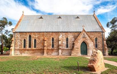 Background image for Australia's Cheapest Property Sales This Year Start at $60k — Including a Church and an Abandoned Three-Bedroom House