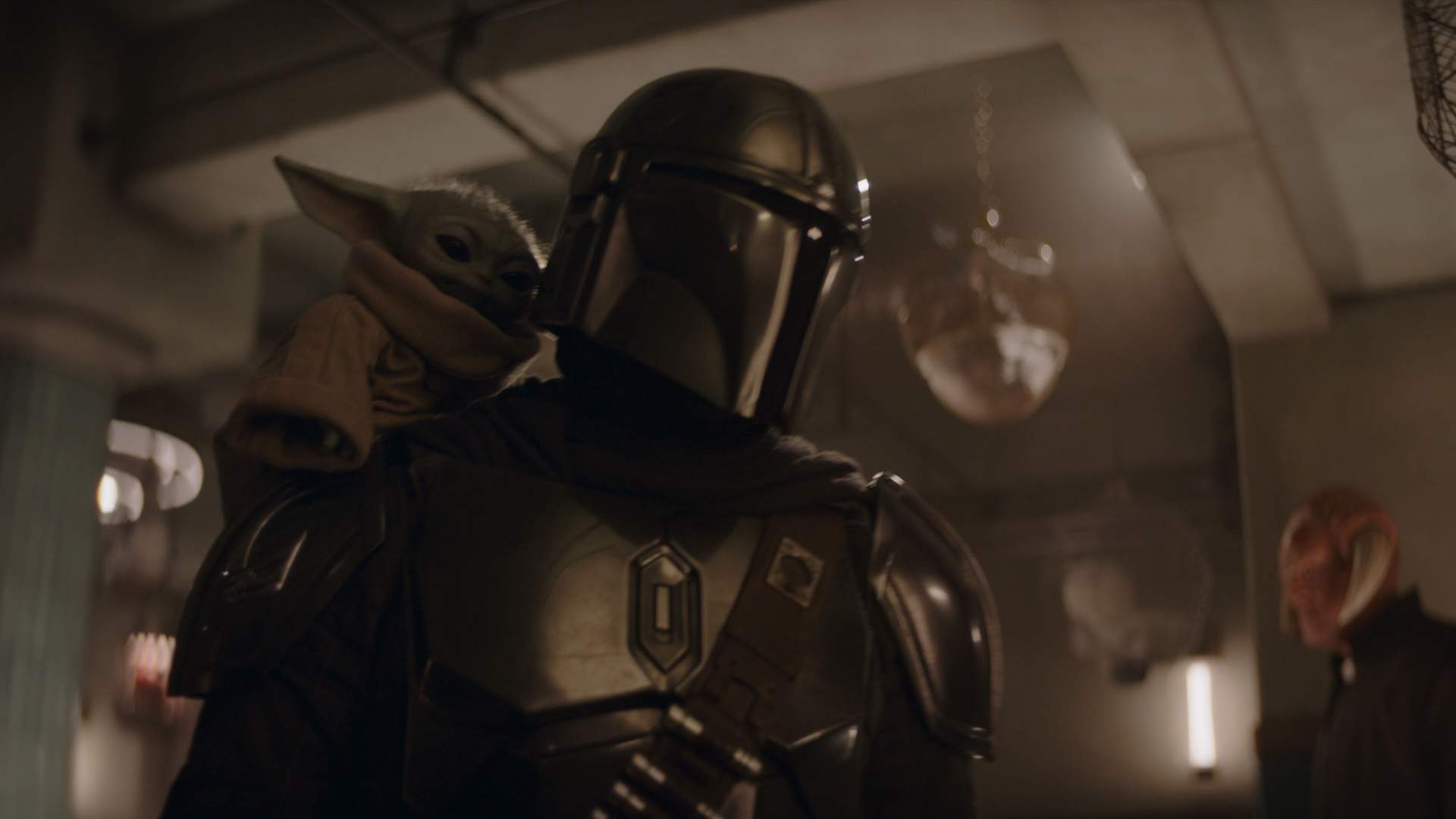 (L-R) Grogu and Mandalorian (Pedro Pascal) in Lucasfilm's THE MANDALORIAN & GROGU. Photo courtesy of Lucasfilm. © 2025 Lucasfilm Ltd™. All Rights Reserved.