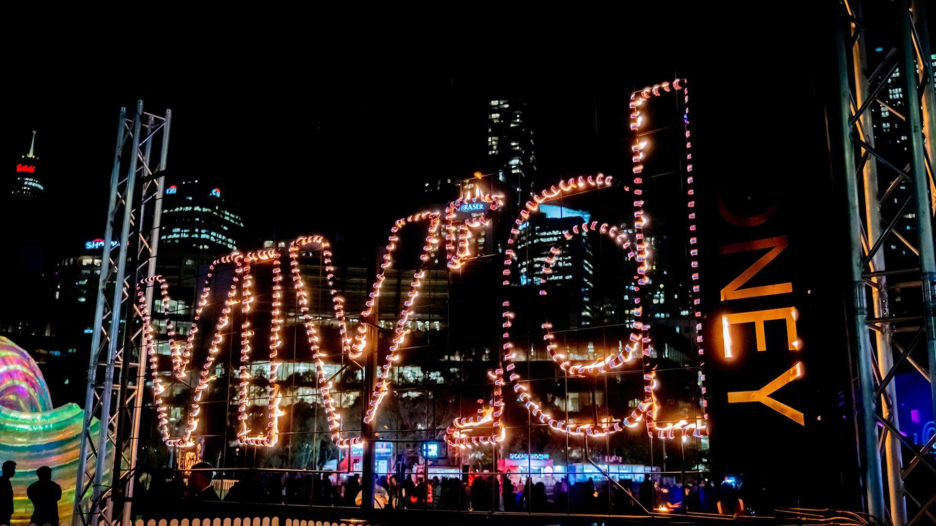 Fireplaces celebrates this timeless ritual, transforming key locations across Vivid Sydney into glowing gathering places. Experience the mesmerising glow of giant fire pits, awe-inspiring fire sculptures, flame throwers and fire barrels. Fireplaces brings warmth to these Vivid Sydney winter nights at Vivid Fire Kitchen. Artist - Foti International (Australia)