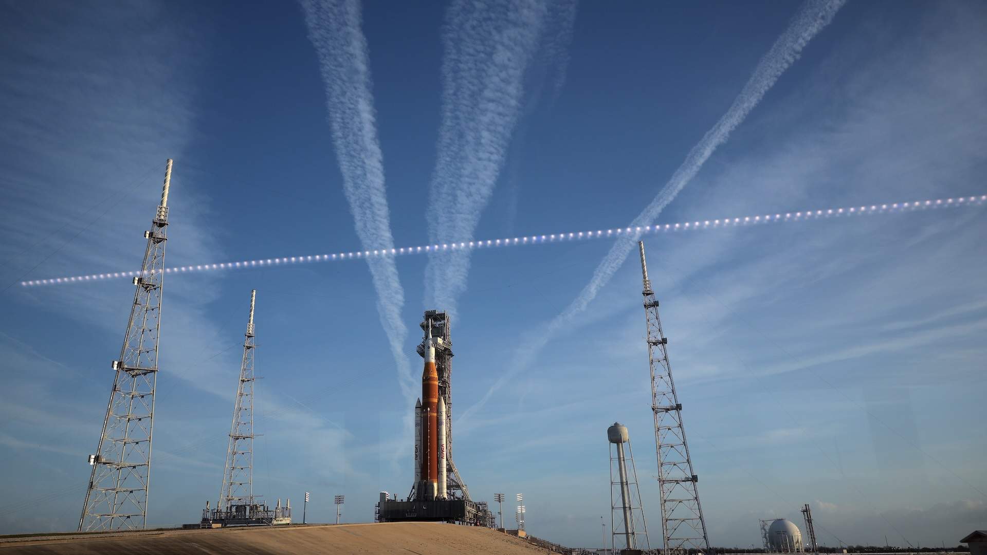CAPE CANAVERAL, FLORIDA - MARCH 31: NASA's 322-foot-tall Artemis II Space Launch System rocket and Orion spacecraft stand on Launch Complex 39B at Kennedy Space Center on March 31, 2026 in Cape Canaveral, Florida. The 10-day mission will take NASA astronauts Commander Reid Wiseman, Pilot Victor Glover and Mission Specialist Christina Koch and CSA (Canadian Space Agency) Mission Specialist Jeremy Hansen around the moon and back. The astronauts are supposed to fly 230,000 miles out into space, the farthest any human has ever traveled from Earth. (Photo by Chip Somodevilla/Getty Images)