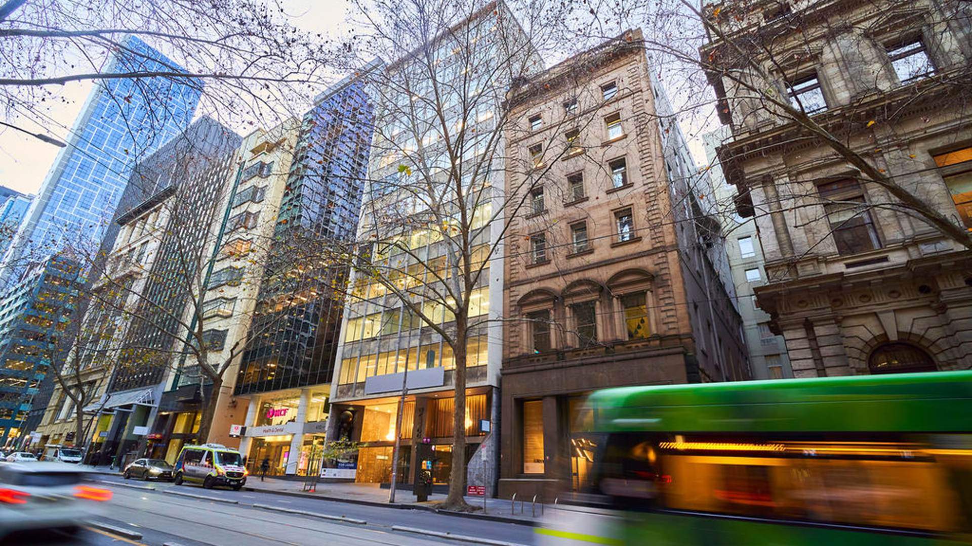 Collins Street in Melbourne's CBD lined with heritage and glass office towers