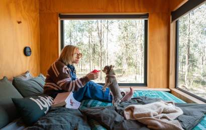 Background image for Lyka and Unyoked Have Teamed Up on Two Off-Grid Cabins That Give Dogs the Nature Escape, Treats and Fireplace Cuddles They Deserve