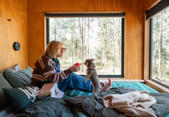 Background image for Lyka and Unyoked Have Teamed Up on Two Off-Grid Cabins That Give Dogs the Nature Escape, Treats and Fireplace Cuddles They Deserve